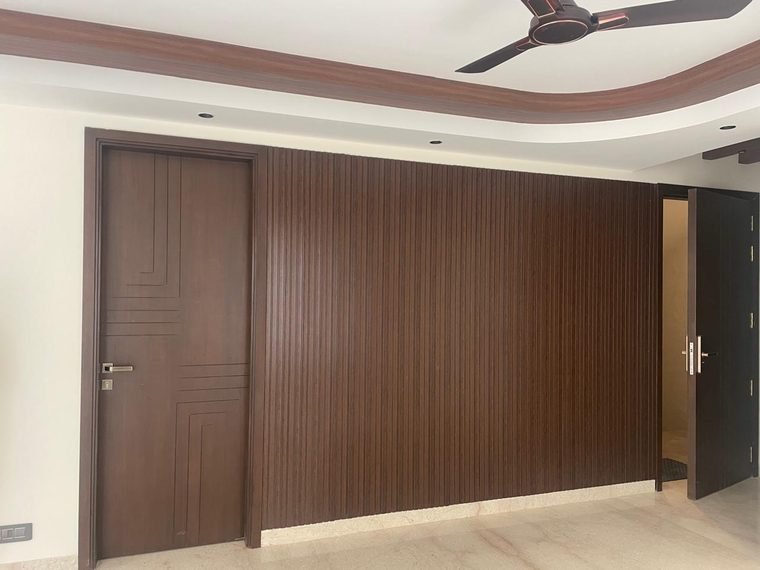 Kitchen with stone counter and fluted units